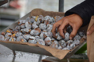 Close-up of man preparing food