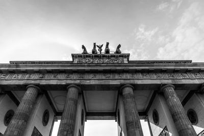 Low angle view of triumphal arch against sky