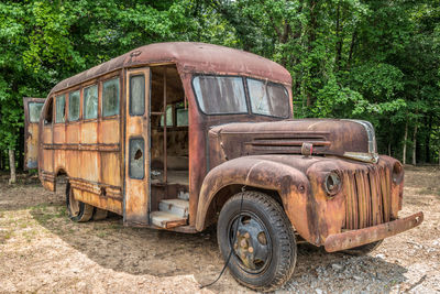 Abandoned car on field