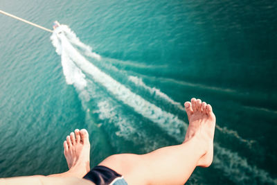 Low section of man on boat in sea