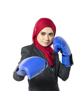 Portrait of beautiful young woman against white background