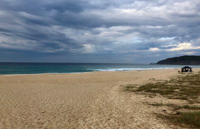 Scenic view of beach against sky