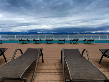 Panoramic view from an empty cruise ship deck with sunchairs