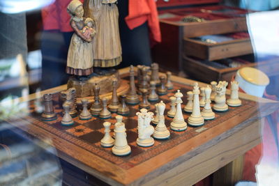 Close-up of chess pieces on table