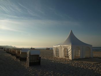 Scenic view of beach against sky during sunset