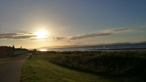 Scenic view of beach against sky during sunset