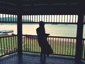 Silhouette of man standing in corridor