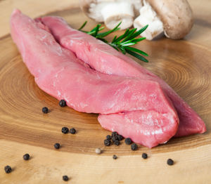 Close-up of meat on cutting board