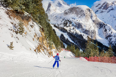 Man skiing on snowcapped mountain