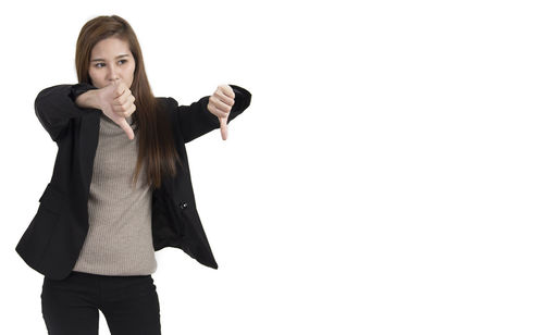 Portrait of young woman against white background