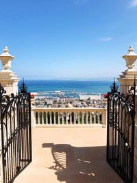 Scenic view of sea against buildings