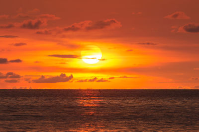 Scenic view of sea against romantic sky at sunset