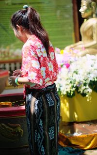 Side view of woman at songkran festival