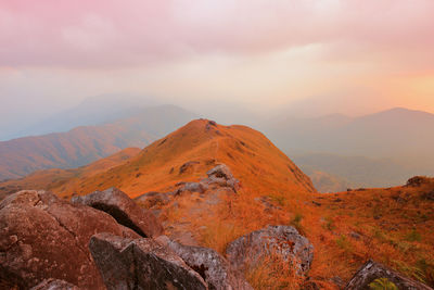 Scenic view of mountain against sky during sunset