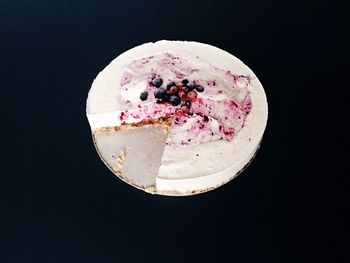 Directly above shot of ice cream over black background