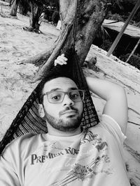 Portrait of young man relaxing outdoors