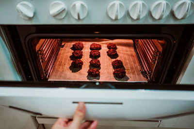 Cropped hand of person preparing food