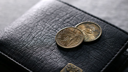 Close-up of coins on table
