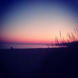 Scenic view of sea against clear sky at sunset