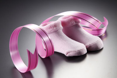 Close-up of pink socks with decoration