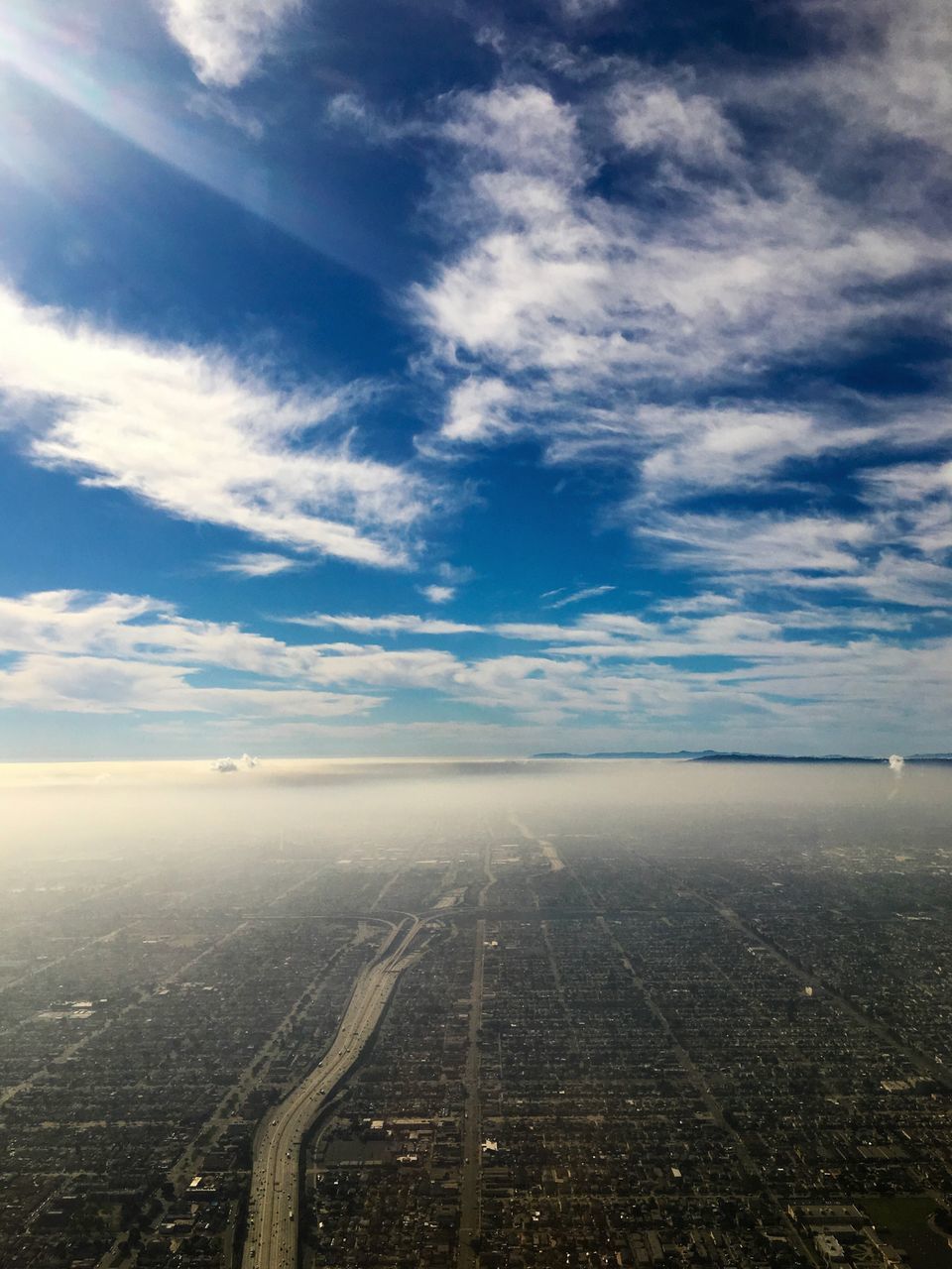 sky, cloud - sky, aerial view, cityscape, outdoors, no people, horizon over land, day, landscape, scenics, city, beauty in nature, architecture, airplane, nature