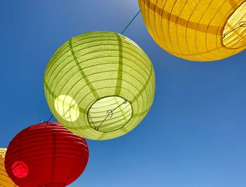 Low angle view of hot air balloon against blue sky