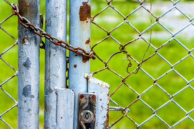 Close-up of chain on chainlink fence