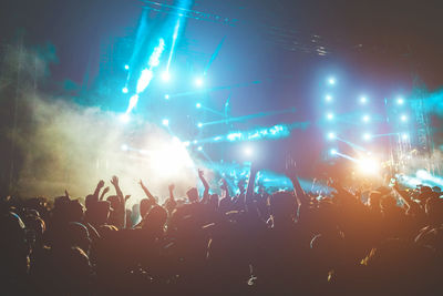 Crowd at music concert during night