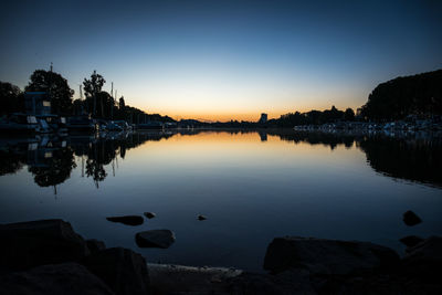 Scenic view of lake against sky during sunset