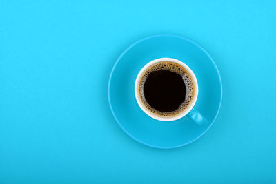 Directly above shot of coffee cup on table