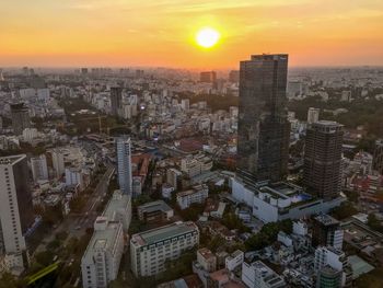 High angle view of buildings against sky during sunset