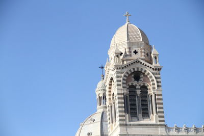 High section of church against blue sky