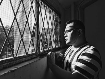 Prisoner looking through window