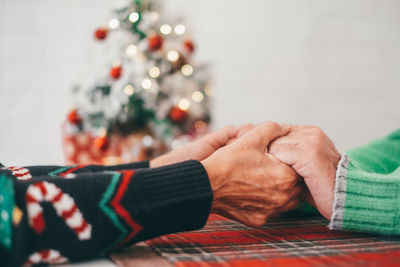 Couple holding hands during christmas