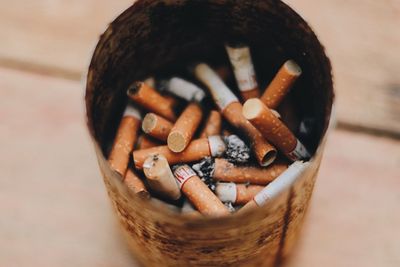 Close-up of cigarette smoking on table