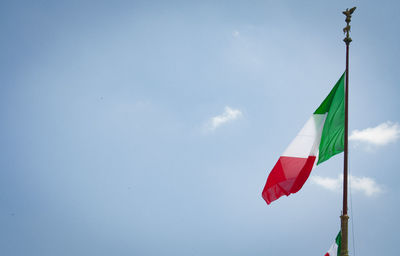 Low angle view of flag against sky