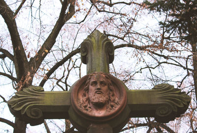 Low angle view of statue against sky