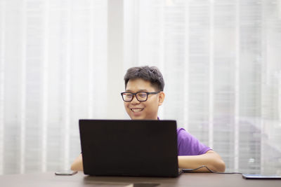Mid adult man using smart phone