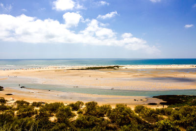 View of seascape against cloudy sky