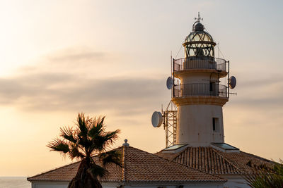 Sunrise over the lighthouse of cullera, valencia.