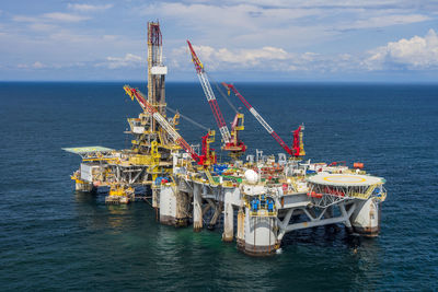 High angle view of oil exploration platform amidst sea