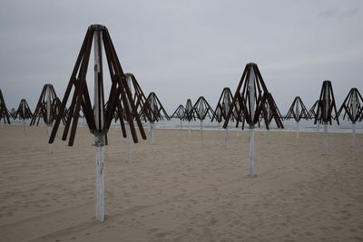 Wooden posts on beach