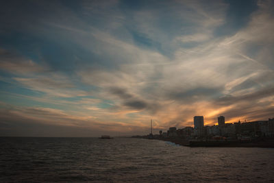 View of sea against cloudy sky during sunset