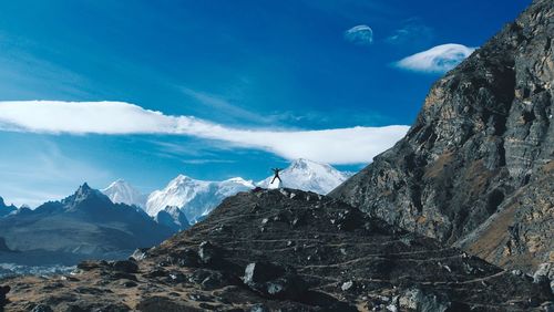 Scenic view of mountains against blue sky