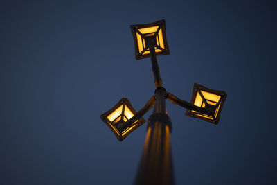 Bottom view of street light on blue sky . night shot