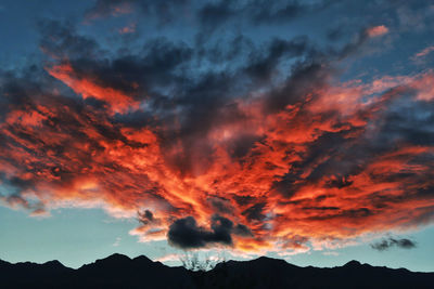 Low angle view of dramatic sky during sunset