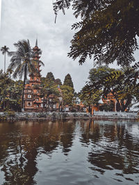 Reflection of trees and building on water