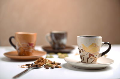 Close-up of coffee served on table