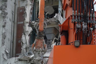 Abandoned building against orange wall