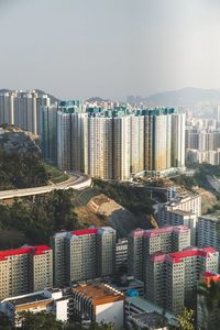 High angle view of buildings in city against sky